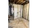 Unfinished basement featuring a water heater with exposed framing, pipes and duct work at 4688 Brice Dr, Union City, GA 30291