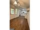 Kitchen area with wood-look flooring, white cabinets, and a view to the backyard at 4688 Brice Dr, Union City, GA 30291