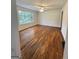 Spacious living room with hardwood floors, bright natural light, and a ceiling fan at 4688 Brice Dr, Union City, GA 30291