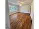 Spacious living room with hardwood floors, bright natural light, and a ceiling fan at 4688 Brice Dr, Union City, GA 30291