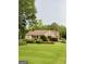 Sprawling home exterior with manicured lawn and mature trees at 7970 Berea Rd, Winston, GA 30187