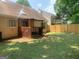Large backyard featuring a covered patio area, perfect for outdoor relaxation and entertaining at 3232 Deer Pause Ln, Decatur, GA 30034