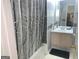 Bathroom featuring a vanity with a sink and a shower with a patterned curtain at 3232 Deer Pause Ln, Decatur, GA 30034