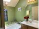 Bright bathroom featuring a skylight, white countertop, and decorative accents at 3232 Deer Pause Ln, Decatur, GA 30034