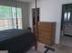 Bedroom with a chest of drawers, closet, and an ensuite bathroom at 3232 Deer Pause Ln, Decatur, GA 30034