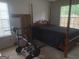 Bedroom with workout equipment and a four-poster bed frame at 3232 Deer Pause Ln, Decatur, GA 30034