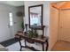 Bright foyer with a decorative table and mirror, adding a touch of elegance to the entryway at 3232 Deer Pause Ln, Decatur, GA 30034