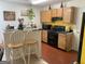Functional kitchen with wood cabinets, black appliances, and a breakfast bar for casual dining at 3232 Deer Pause Ln, Decatur, GA 30034
