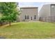 A backyard with a green lawn, fence and patio at 529 Dasheill Ln, Atlanta, GA 30349