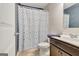 Bathroom with decorative curtain, modern sink and cabinets at 529 Dasheill Ln, Atlanta, GA 30349
