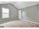 Empty bedroom featuring gray walls, carpet, and a window at 529 Dasheill Ln, Atlanta, GA 30349