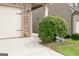 View of the driveway and landscaped yard with decorative bike accent at 529 Dasheill Ln, Atlanta, GA 30349