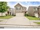Inviting two-story home featuring stone accents, a two-car garage, and a long driveway at 529 Dasheill Ln, Atlanta, GA 30349