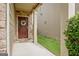 Charming front porch with a stone pillar and a decorative wreath on the front door at 529 Dasheill Ln, Atlanta, GA 30349