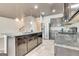 Granite counter tops, stainless steel appliances, and a kitchen island in a kitchen with tile floors and a dark ceiling at 529 Dasheill Ln, Atlanta, GA 30349