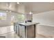 Kitchen island with granite countertops with view of the living room fireplace at 529 Dasheill Ln, Atlanta, GA 30349