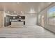 Open living space with kitchen and dining areas, offering natural light and exterior access to the backyard at 529 Dasheill Ln, Atlanta, GA 30349