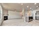 Open living space featuring a kitchen, dining and living area with a fireplace and stairs to the second floor at 529 Dasheill Ln, Atlanta, GA 30349