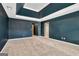 Expansive main bedroom with tray ceiling, carpeted floors, and neutral-toned walls at 529 Dasheill Ln, Atlanta, GA 30349