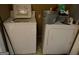 Practical laundry room featuring a white washer and dryer for convenient chore completion at 412 Sycamore Dr # D, Decatur, GA 30030