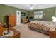 Comfortable bedroom with carpet flooring, ceiling fan, and an ensuite bathroom at 2866 Rosecommons Dr, Hampton, GA 30228