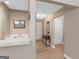 Bright foyer featuring wood-look flooring, convenient closet space, and classic decorative details for a warm welcome at 2866 Rosecommons Dr, Hampton, GA 30228