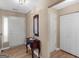 Bright foyer featuring wood-look flooring, convenient closet space, and classic decorative details for a warm welcome at 2866 Rosecommons Dr, Hampton, GA 30228