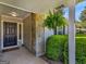 Welcoming front porch with stone detail, lush greenery, and inviting entryway showcasing curb appeal at 2866 Rosecommons Dr, Hampton, GA 30228