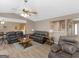 Cozy living room featuring leather furnishings, a ceiling fan, and hardwood floors at 2866 Rosecommons Dr, Hampton, GA 30228