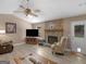 Cozy living room with vaulted ceiling, stone fireplace, and ample space for relaxation and entertainment at 2866 Rosecommons Dr, Hampton, GA 30228