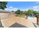 Wooden deck gives way to backyard oasis featuring a pool, trees, and greenery at 11 Chad Ct, Mcdonough, GA 30253
