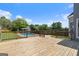 Large wooden deck overlooking the beautiful pool and lush backyard at 11 Chad Ct, Mcdonough, GA 30253
