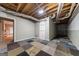 Finished basement featuring open ceiling and colorful squared carpeting at 11 Chad Ct, Mcdonough, GA 30253