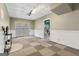 Basement area features ceiling tiles and access to the backyard through French doors at 11 Chad Ct, Mcdonough, GA 30253