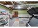 Bright basement with exercise equipment, colorful carpeting, and exposed pipes at 11 Chad Ct, Mcdonough, GA 30253