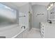 Relaxing bathroom featuring a large soaking tub, separate shower, and updated vanity at 11 Chad Ct, Mcdonough, GA 30253