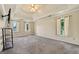 Expansive bedroom with tray ceiling, ceiling fan, carpet, and natural light from windows at 11 Chad Ct, Mcdonough, GA 30253