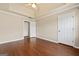 A light and airy bedroom features tray ceiling, hardwood floors, and white doors at 11 Chad Ct, Mcdonough, GA 30253