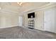 Large bedroom featuring a tray ceiling, ceiling fan, carpet and an entertainment center at 11 Chad Ct, Mcdonough, GA 30253