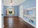 Bright bedroom with hardwood floors, natural light, and a stylish built-in desk feature at 11 Chad Ct, Mcdonough, GA 30253