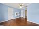 Charming bedroom with hardwood floors, ceiling fan, and a unique built-in desk at 11 Chad Ct, Mcdonough, GA 30253