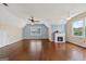 Well lit bonus room with hardwood floors, multiple windows, ceiling fans, and decorative fireplace at 11 Chad Ct, Mcdonough, GA 30253