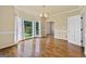 Formal dining room with hardwood floors, natural light from bay window and decorative chandelier at 11 Chad Ct, Mcdonough, GA 30253