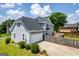 View of home exterior showing the garage, side yard, and fence at 11 Chad Ct, Mcdonough, GA 30253
