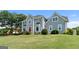 Beautiful two-story home with a red front door and well-manicured lawn at 11 Chad Ct, Mcdonough, GA 30253