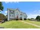 Charming two-story home with gray exterior and a sprawling green lawn at 11 Chad Ct, Mcdonough, GA 30253