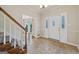 Foyer with tile flooring, staircase, and bright white front door at 11 Chad Ct, Mcdonough, GA 30253