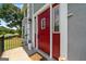 Close up of the front door with a clear storm door and light fixture at 11 Chad Ct, Mcdonough, GA 30253