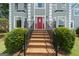 Brick stairs lead up to the home's front entrance and red front door at 11 Chad Ct, Mcdonough, GA 30253