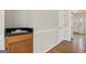 Bright hallway with hardwood floors, a sink, and an open doorway to the home's entrance at 11 Chad Ct, Mcdonough, GA 30253